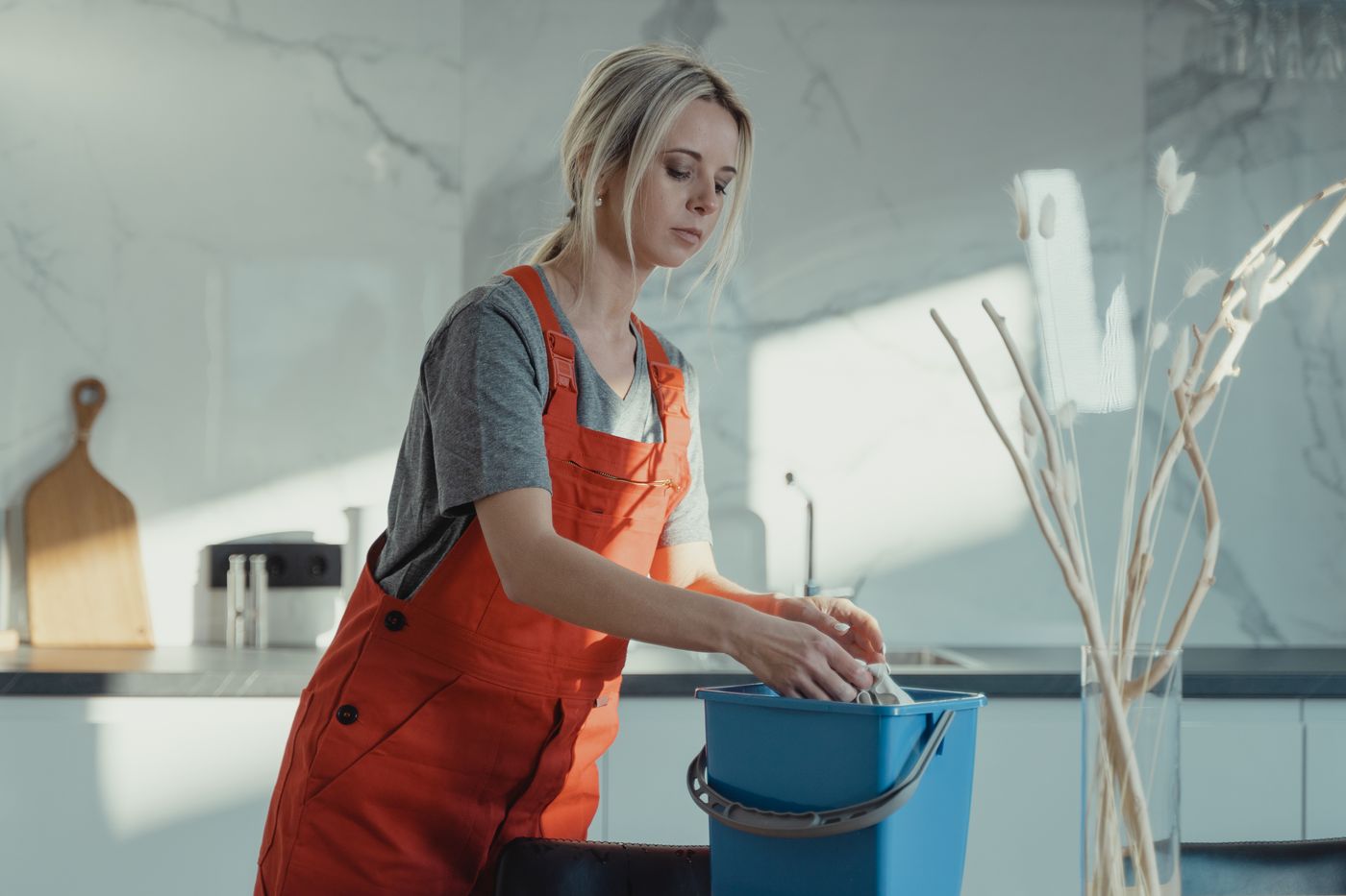 Cleaner working in a domestic kitchen